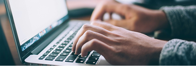 Person typing on laptop