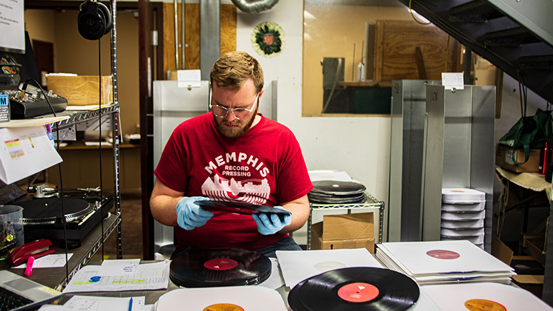 man pressing record