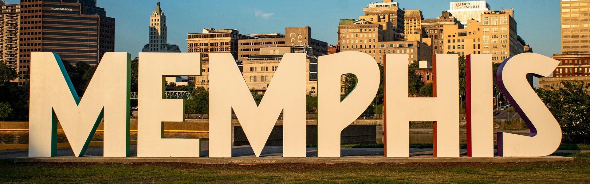 dusk photo of memphis sign and downtown