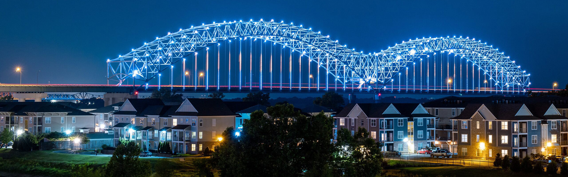 Harbortown view at night with lights across bridge