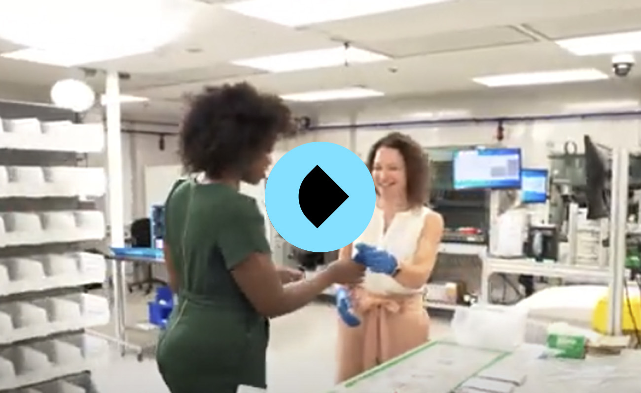 Two women interacting in a lab