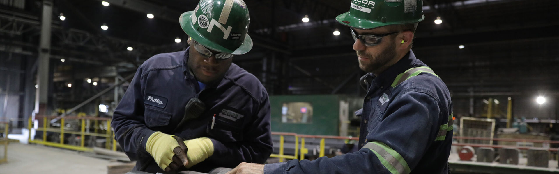 two men in factory working