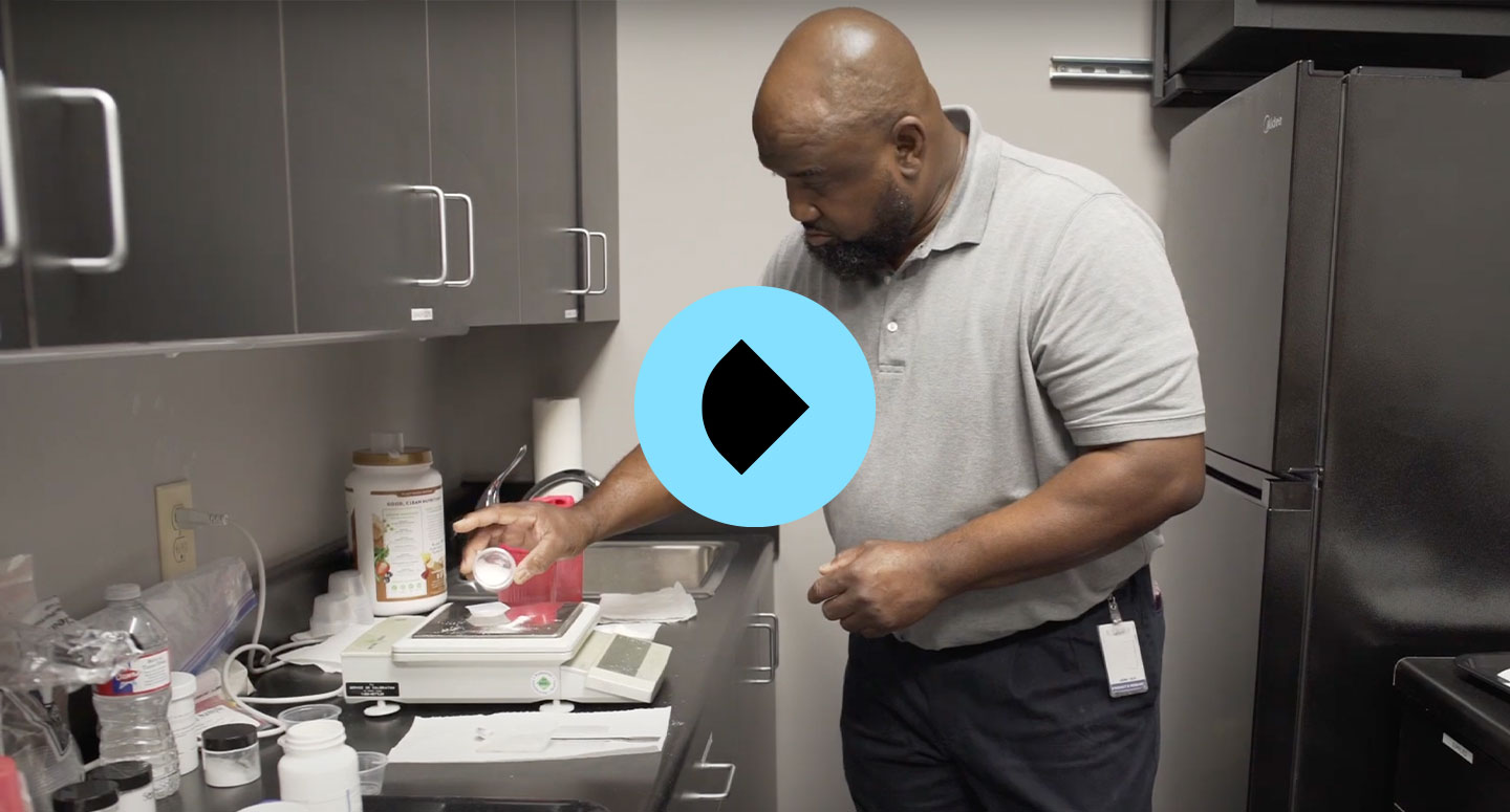 man mixing powders