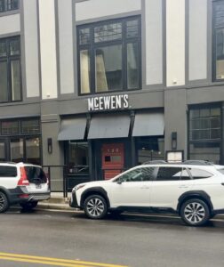 McEwen's store front with a red door.