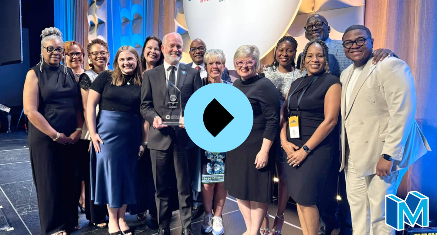 Group photo with award and play button